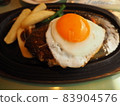 Juicy hamburger steak with thick eggs 83904576