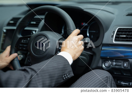 Car steering wheel businessman Car steering wheel businessman 83905478