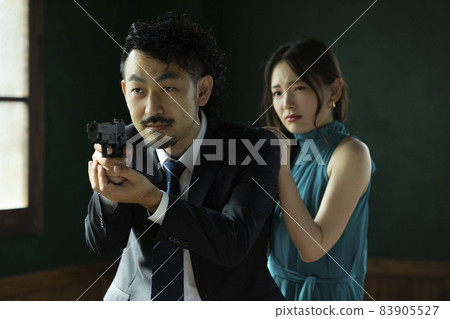 A bearded person who protects a beautiful woman A bearded person who protects a beautiful woman 83905527