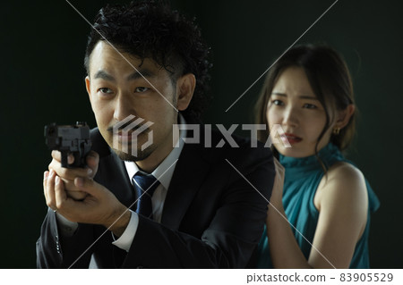 A bearded person who protects a beautiful woman 83905529