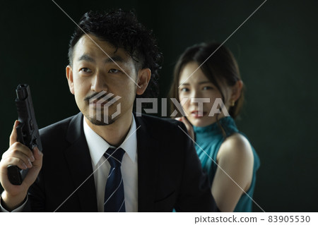A bearded person who protects a beautiful woman A bearded person who protects a beautiful woman 83905530