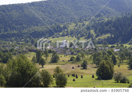 Carpathian village: country houses, gardens, forest and mountains Carpathian village: country houses, gardens, forest and mountains 83905798