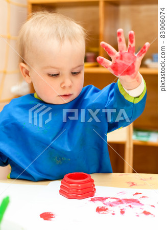 Child painting with hand Child painting with hand 83906074