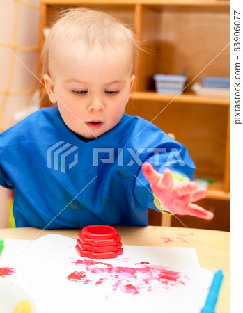 Child painting with hand Child painting with hand 83906077