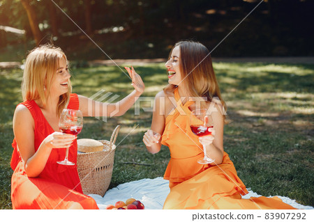Elegant and stylish girls in a summer park 83907292