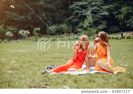Elegant and stylish girls in a summer park 83907317