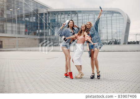 Elegant and stylish girls standing near the airport 83907406