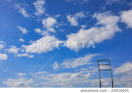 A refreshing blue blue sky, clouds and silver objects A refreshing blue blue sky, clouds and silver objects 83910045