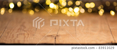 empty wooden table top with blurred light gold bokeh abstract background. For montage product display or design key visual layout 83911029