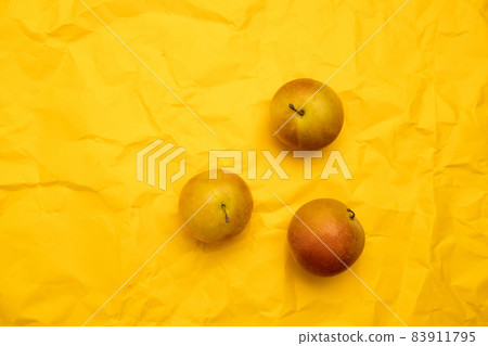 Close up of juicy organic plums on yellow background, copy space. Top view, flat lay. Summer cherry plum. Food pattern 83911795