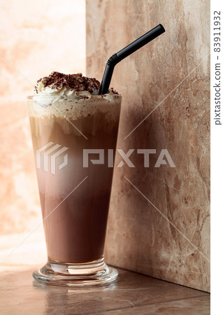 Milk coffee cocktail with whipped cream. Milk coffee cocktail with whipped cream. 83911932