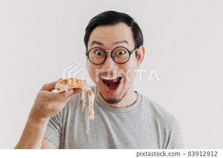 Funny face nerd man has cheesy pizza isolated on white background. 83912912