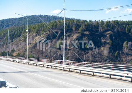 Automobile bridge against the background of mountainous terrain. 83913014