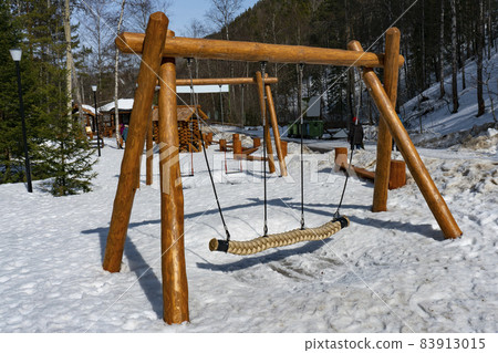 Childrens swing in the winter in the national park. 83913015