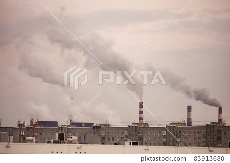 industrial chimneys with heavy smoke causing air pollution on gray sky background industrial chimneys with heavy smoke causing air pollution on gray sky background 83913680