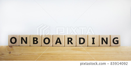 Onboarding symbol. The word 'Onboarding' on wooden cubes. Business and onboarding concept. Beautiful wooden table, white background. Copy space. Onboarding symbol. The word 'Onboarding' on wooden cubes. Business and onboarding concept. Beautiful wooden table, white background. Copy space. 83914092