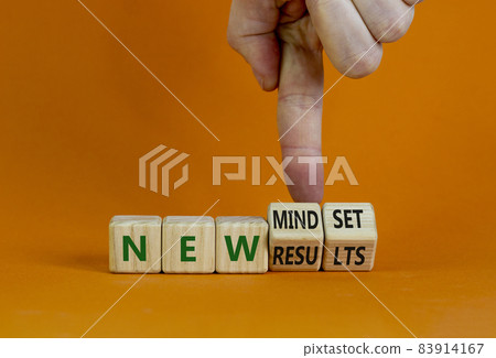 New mindset and results symbol. Businessman turns wooden cubes and changes words 'new mindset' to 'new results'. Beautiful orange background. Business, new mindset and results concept. Copy space. New mindset and results symbol. Businessman turns wooden cubes and changes words 'new mindset' to 'new results'. Beautiful orange background. Business, new mindset and results concept. Copy space. 83914167