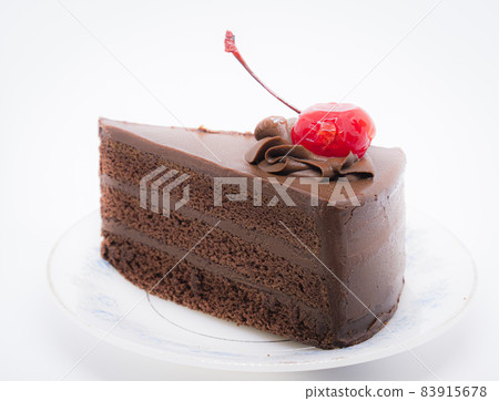 Chocolate cake with topping cherry in ceramic plate. Delicious cuisine dessert over white background 83915678