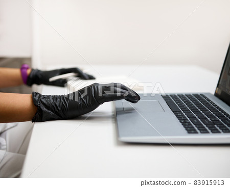 Cropped view of woman doctor in white medical uniform sit at desk in hospital typing texting consulting client online on laptop, female GP busy working on modern computer gadget in private clinic Cropped view of woman doctor in white medical uniform sit at desk in hospital typing texting consulting client online on laptop, female GP busy working on modern computer gadget in private clinic 83915913