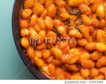 Italian potato gnocchi pasta with tomato sauce and mozzarella cheese 83915995