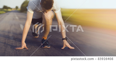 A young man trains and runs early in the morning. A young man trains and runs early in the morning. 83916408
