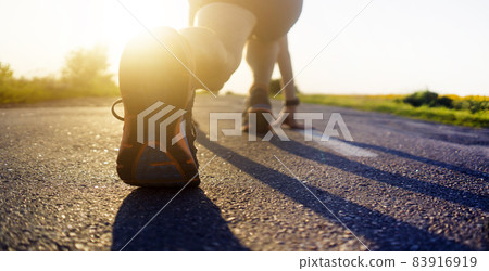 Runner legs running on treadmill close-up on shoe. Runner legs running on treadmill close-up on shoe. 83916919