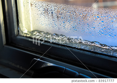 Ice and condensation forming on a window 83917777