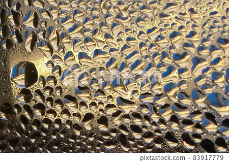 Macro view of condensation on a window Macro view of condensation on a window 83917779