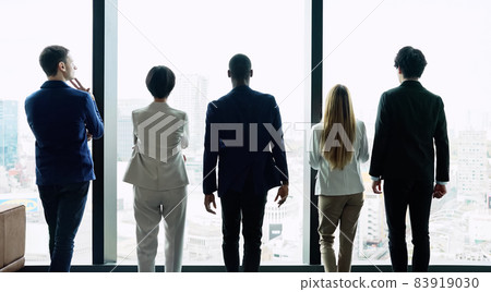 People looking out from the office Global business People looking out from the office Global business 83919030