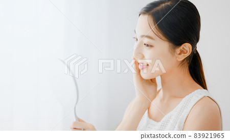 Beauty image Young woman doing skin care 83921965