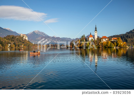 Panoramic view of Julian Alps, Lake Bled with St. Marys Church of the Assumption on the small island. Bled, Slovenia, Europe. 83923036