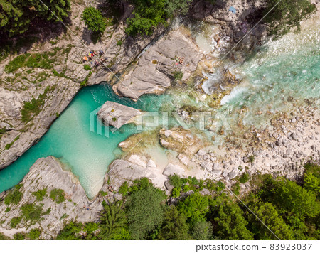 Aerial drone view of magical turquoise color of Soca river, Slovenia 83923037