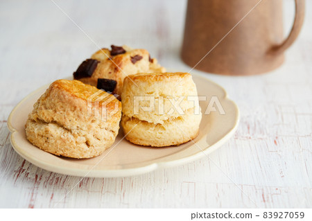 Various types of scones and mugs Various types of scones and mugs 83927059
