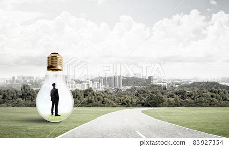 Businessman inside light bulb 83927354