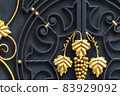 Decorative gilded elements of forged metal fence. 83929092
