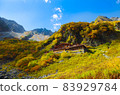 Karasawa Hutte at the peak of autumn colors 83929784