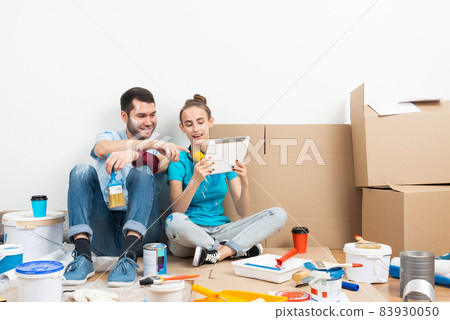 Couple watching something funny on tablet computer 83930050