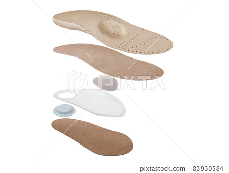 Medical insoles. Isolated orthopedic insoles on a white background. Treatment and prevention of flat feet and foot diseases. Foot care. Insole cutaway layers. Medical insoles. Isolated orthopedic insoles on a white background. Treatment and prevention of flat feet and foot diseases. Foot care. Insole cutaway layers. 83930584