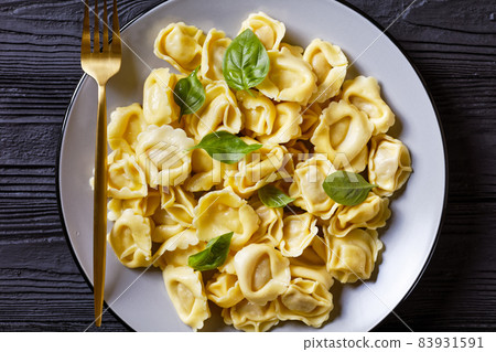 tortelloni with cheese filling on a plate tortelloni with cheese filling on a plate 83931591