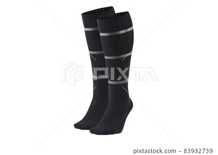 Black color socks isolated on white background. One pair of socks. Set of black socks for sports on foot as mock up for advertising, branding, design mockup, isolated, clipping path. 83932739