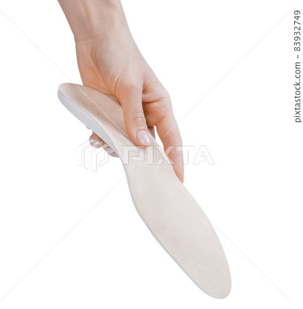 Orthopedic insole isolated on a white background. Medical insoles. Treatment and prevention of flat feet and foot diseases. Foot care, feet comfort. Wear comfortable shoes. Flat Feet Correction. Orthopedic insole isolated on a white background. Medical insoles. Treatment and prevention of flat feet and foot diseases. Foot care, feet comfort. Wear comfortable shoes. Flat Feet Correction. 83932749