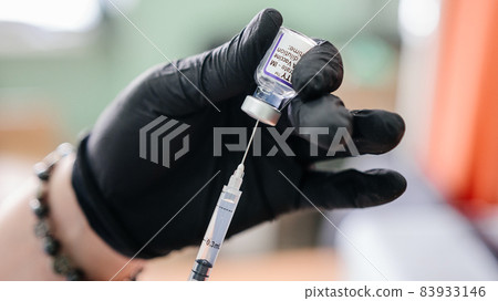 Kalush, Ukraine September 14, 2021: Pfizer antiviral vaccine in a vial against covid infection. Kalush, Ukraine September 14, 2021: Pfizer antiviral vaccine in a vial against covid infection. 83933146