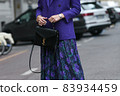 Milan, Italy - September 25, 2021:  Street style outfit, woman wearing a fashionable outfit on the streets of Milan, Italy. 83934459