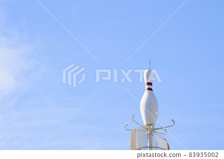 A huge bowling pin installed on the roof of a building A huge bowling pin installed on the roof of a building 83935002