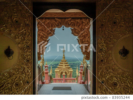 Forest landscape under cloudy blue sky from gate of Wat Phra That Doi Phra Chan in Lampang. 83935244