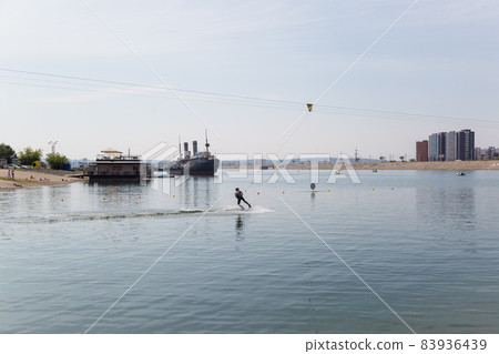Irkutsk, Russia - July 26, 2021, Riding a water board on the lake. Editorial Irkutsk, Russia - July 26, 2021, Riding a water board on the lake. Editorial 83936439