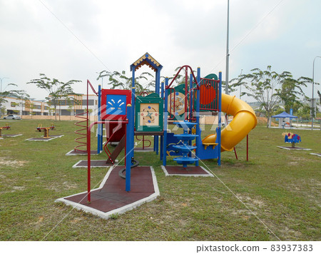 MALACCA, MALAYSIA -MAY 02, 2016: Children outdoor playground in the public park. It was design with few different themes and colorful to give different experience to the kids. MALACCA, MALAYSIA -MAY 02, 2016: Children outdoor playground in the public park. It was design with few different themes and colorful to give different experience to the kids. 83937383