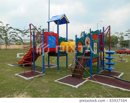 MALACCA, MALAYSIA -MAY 02, 2016: Children outdoor playground in the public park. It was design with few different themes and colorful to give different experience to the kids.  83937384