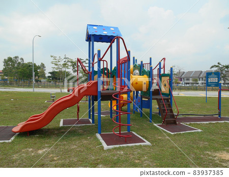 MALACCA, MALAYSIA -MAY 02, 2016: Children outdoor playground in the public park. It was design with few different themes and colorful to give different experience to the kids. MALACCA, MALAYSIA -MAY 02, 2016: Children outdoor playground in the public park. It was design with few different themes and colorful to give different experience to the kids. 83937385