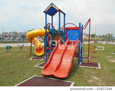 MALACCA, MALAYSIA -MAY 02, 2016: Children outdoor playground in the public park. It was design with few different themes and colorful to give different experience to the kids. MALACCA, MALAYSIA -MAY 02, 2016: Children outdoor playground in the public park. It was design with few different themes and colorful to give different experience to the kids. 83937386